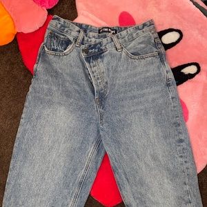 Asymmetrical waist jeans